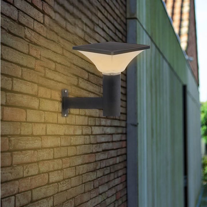 Illustration of a clear square lamp on a bracket against brick