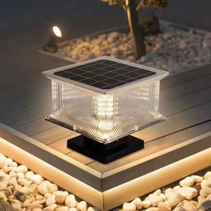 Illustration of a glowing square lamp on timber beside stones