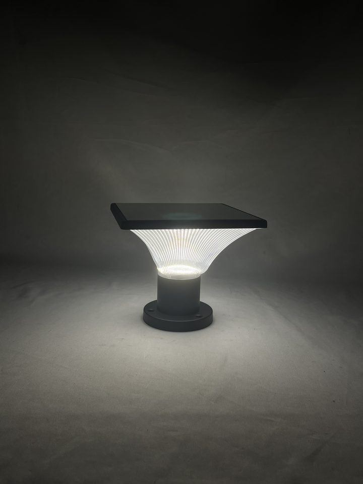 Ribbed square lamp pictured illuminated.