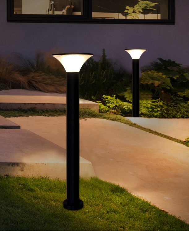 Tall round lamp forms beside a courtyard path in a placement illustration.