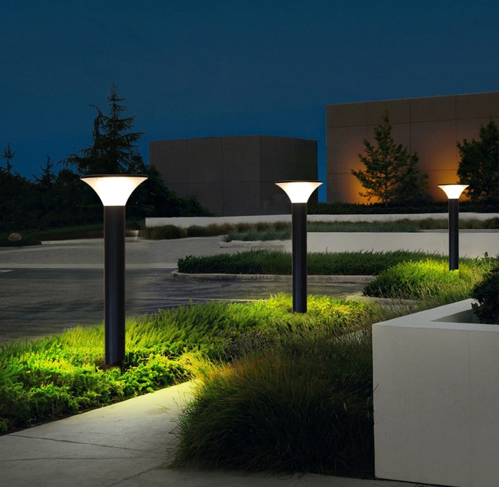 Round lamp forms across a landscaped forecourt in a placement illustration.