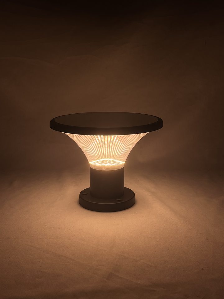 Ribbed round lamp pictured with a warm-looking illuminated shade.