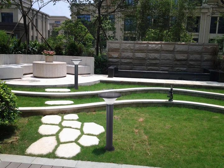 Round lamp forms in a terraced courtyard placement illustration.