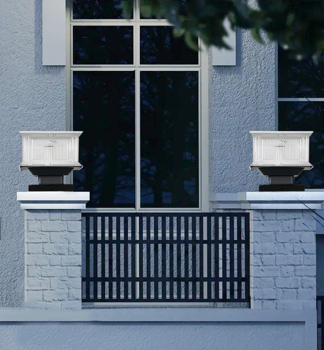Illustration of square lamps on masonry posts beside a metal fence.