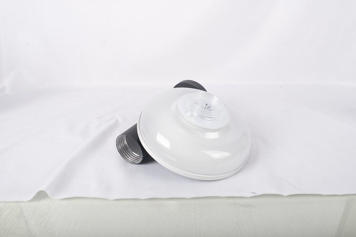 Round lamp underside pictured beside a separate threaded post section.