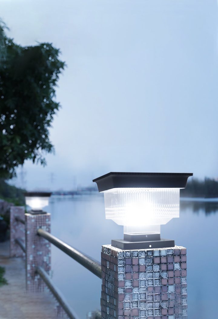 Square-top lamps on waterside railing pillars, illustrative setting (illustration).