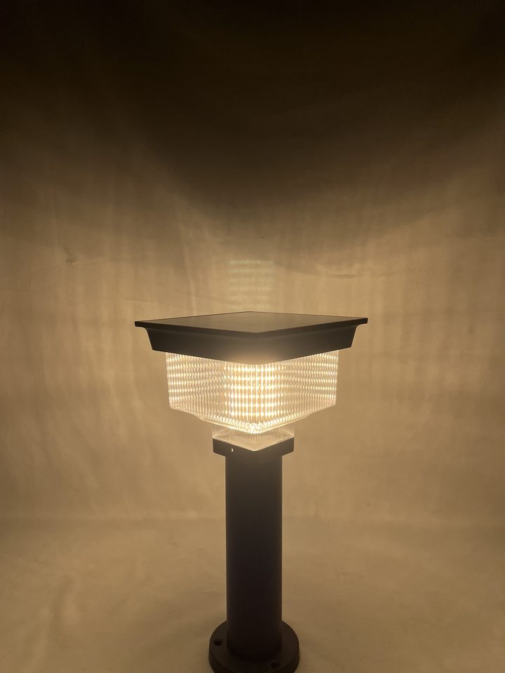 Square-top lamp pictured with a warm-looking glow.